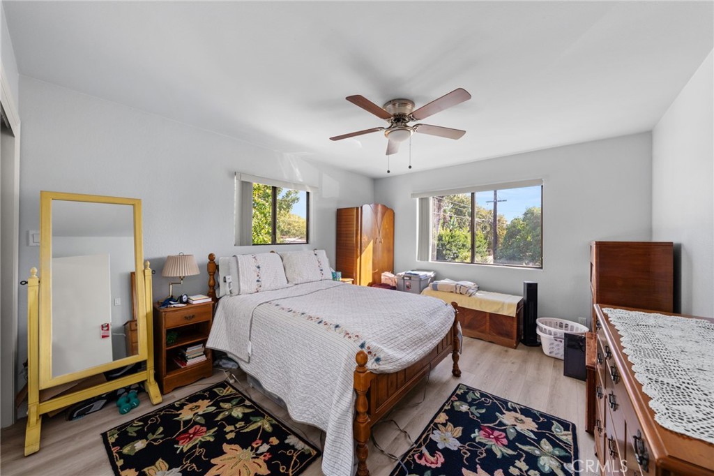 3754 California Long Beach, CA 90807 - Photo 32 of 38 a bed room with a bed a couch and a window