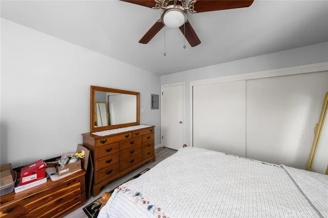 a bedroom with a bed and cabinets