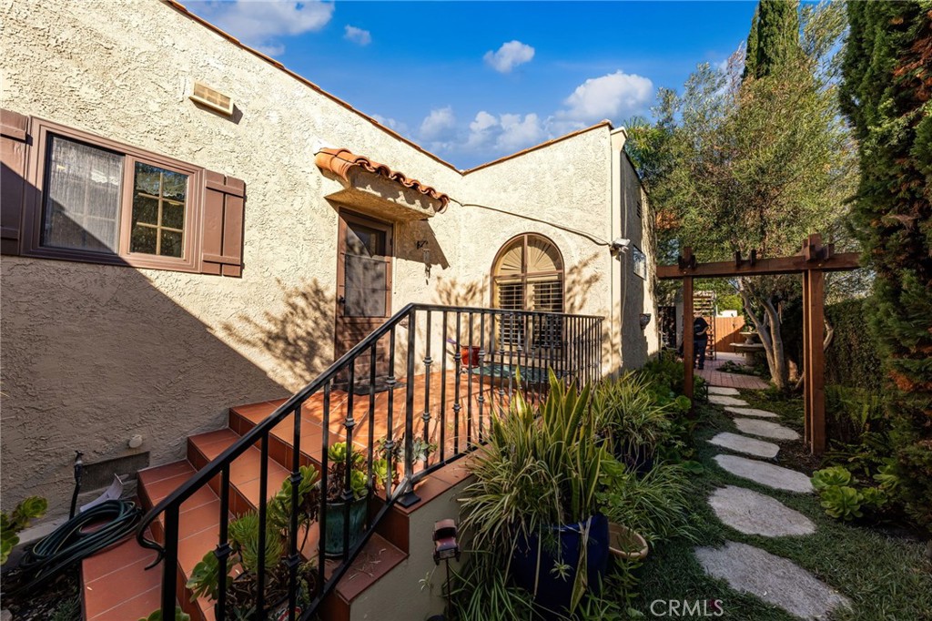 3754 California Long Beach, CA 90807 - Photo 36 of 38 a view of a house with a small yard and potted plants