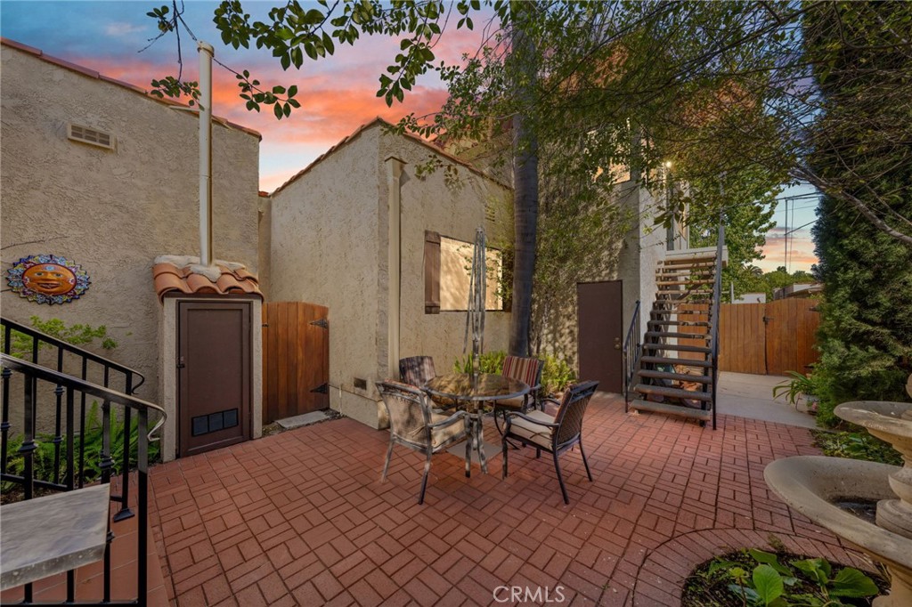 3754 California Long Beach, CA 90807 - Photo 4 of 38 a view of a patio with couches table and chairs and potted plants