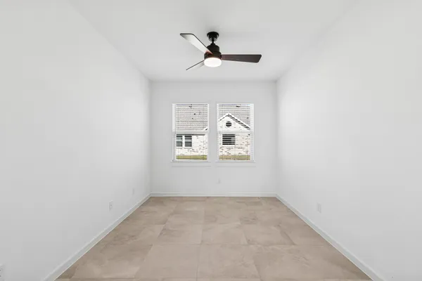 a view of a hallway with windows