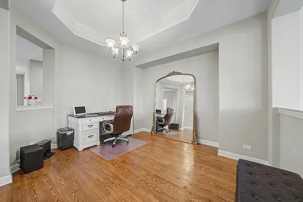 a view of a workspace with furniture and a workspace