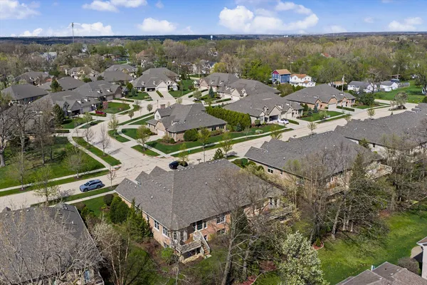 an aerial view of residential houses with outdoor space