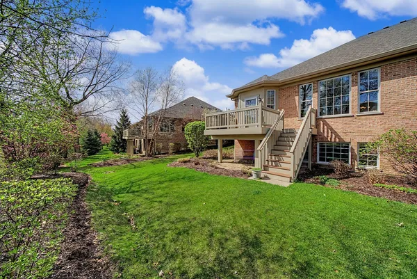 a view of a house with a yard porch and sitting area