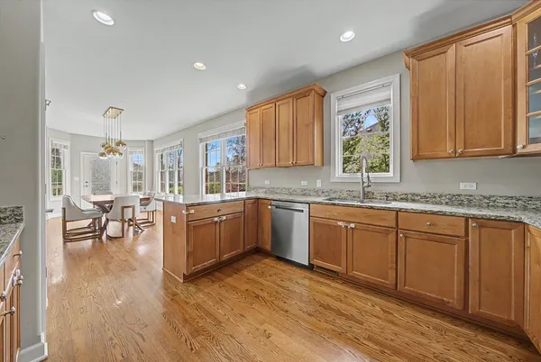 a kitchen with sink cabinets and wooden floor