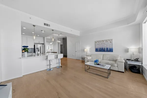 a living room with furniture and white walls