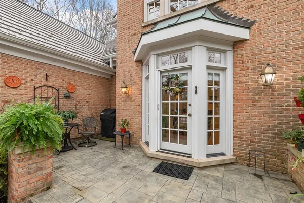 a view of a brick house with a large window