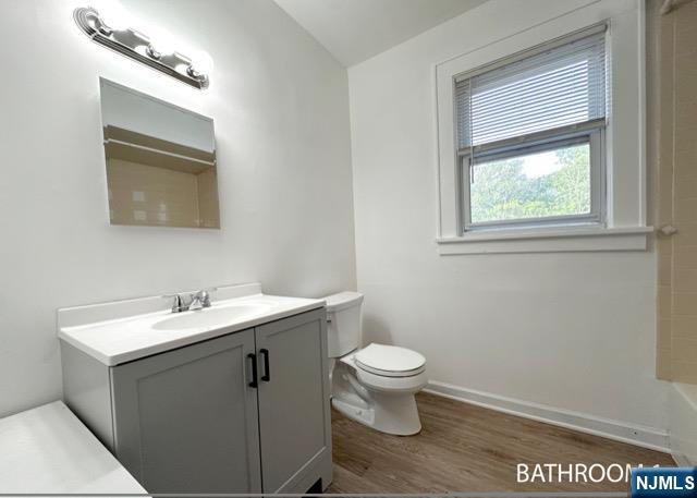1156 High Mountain Road North Haledon, NJ 07508 - Photo 5 of 14 a bathroom with a toilet sink and mirror