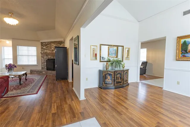 a view of a dining room with furniture and a window