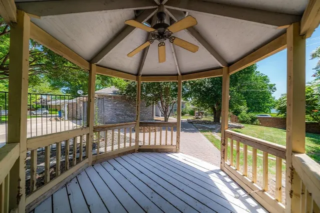 a front view of a house with a yard table and chairs