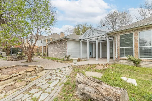a aerial view of a house with a yard