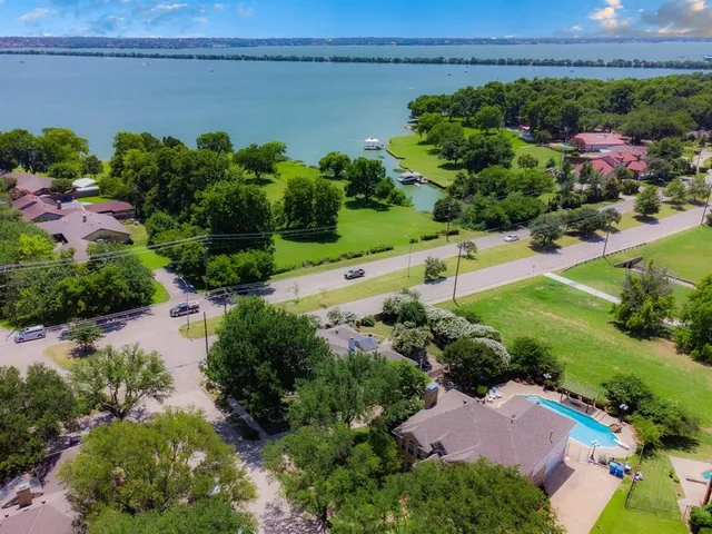 an aerial view of a house with a lake view