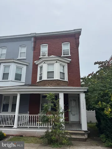 an empty room with wooden floor