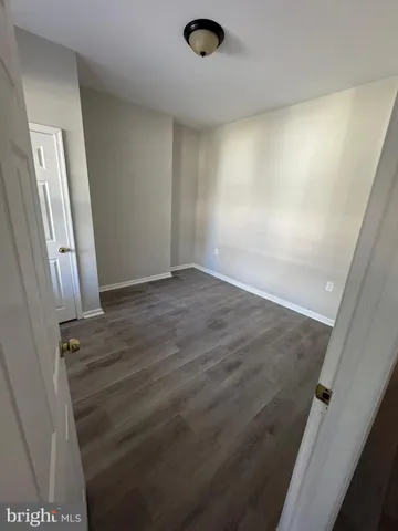 a large kitchen with kitchen island a sink stainless steel appliances and cabinets