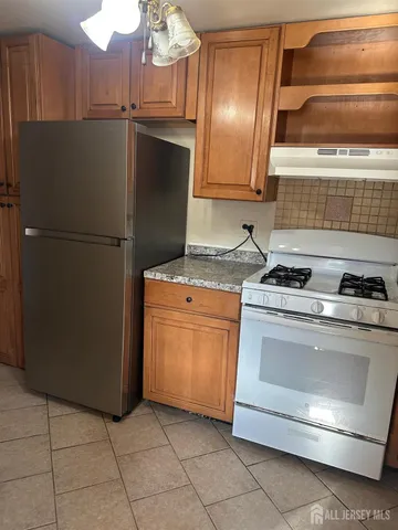 a kitchen with appliances and cabinets