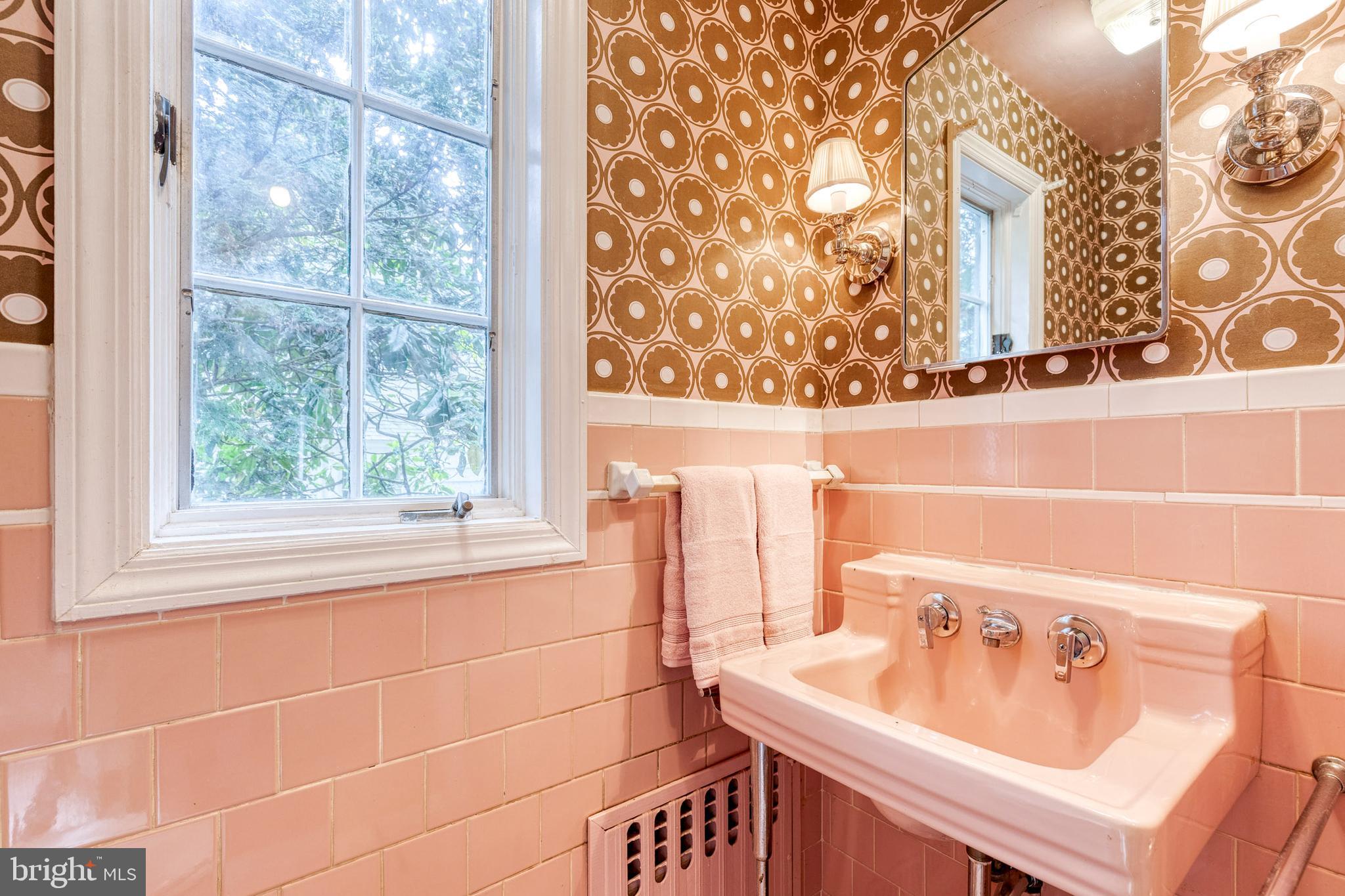 202 Taplow Road Baltimore, MD 21212 - Photo 29 of 56 a bathroom with a sink and a window
