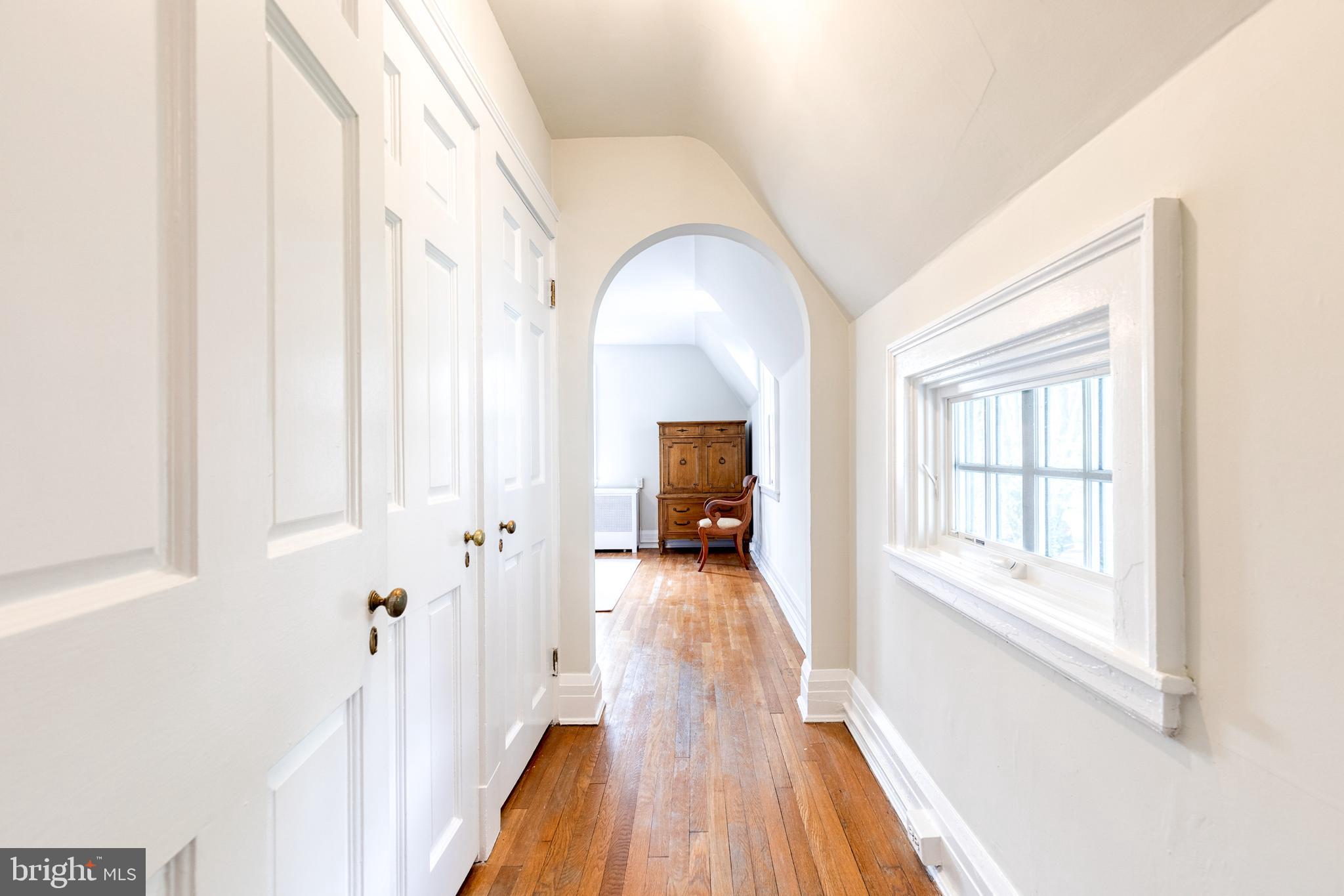 202 Taplow Road Baltimore, MD 21212 - Photo 30 of 56 a view of a hallway with wooden floor and a living room