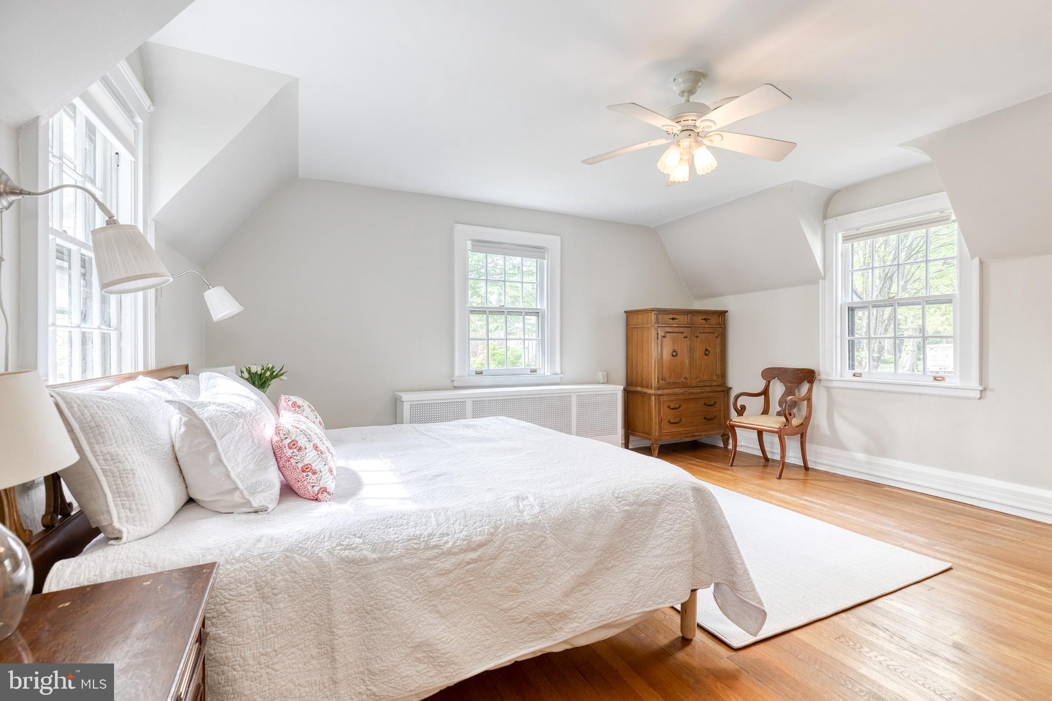 202 Taplow Road Baltimore, MD 21212 - Photo 33 of 56 a bedroom with a large bed and a chandelier