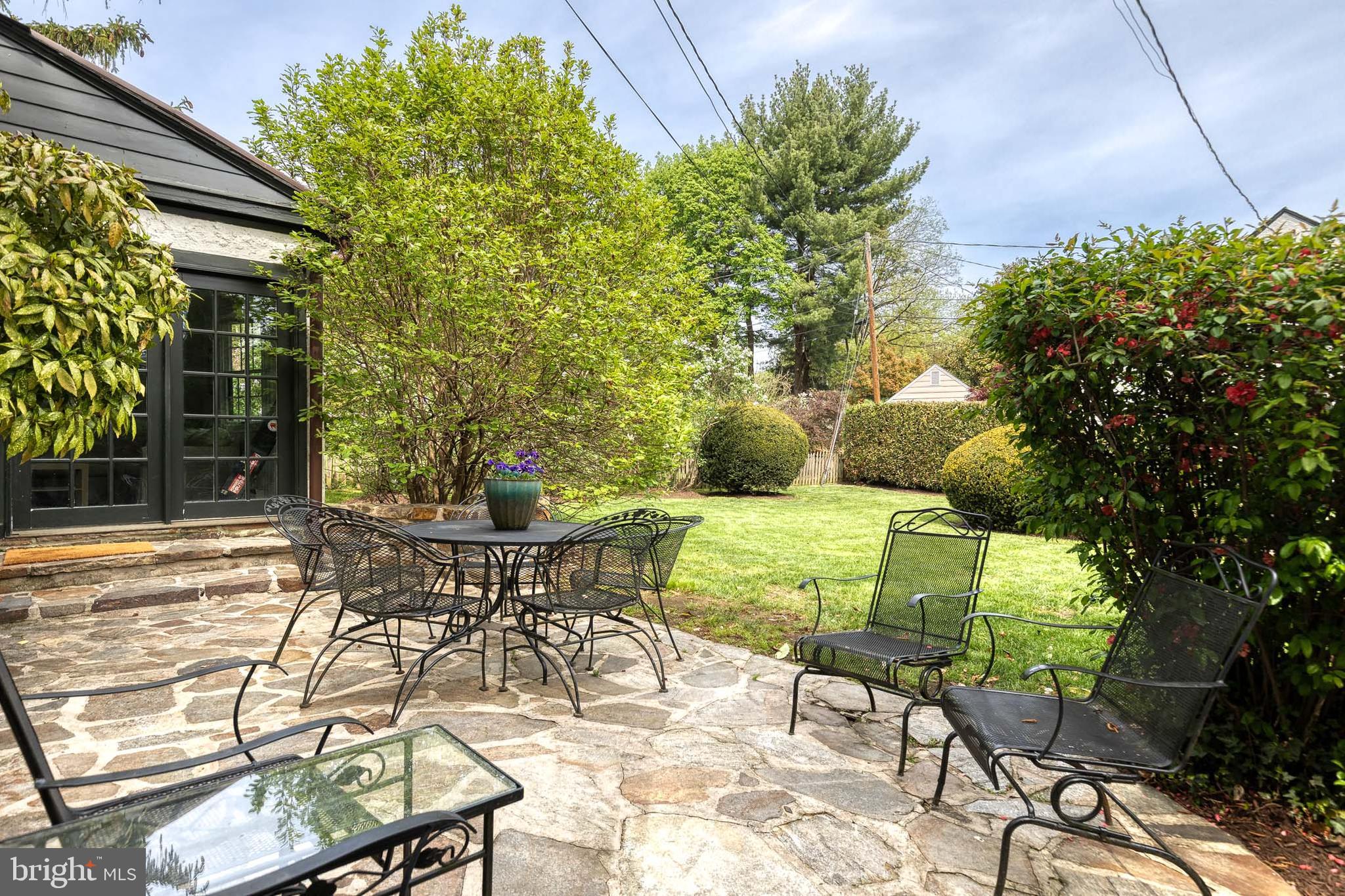202 Taplow Road Baltimore, MD 21212 - Photo 45 of 56 a patio with table and chairs and potted plants
