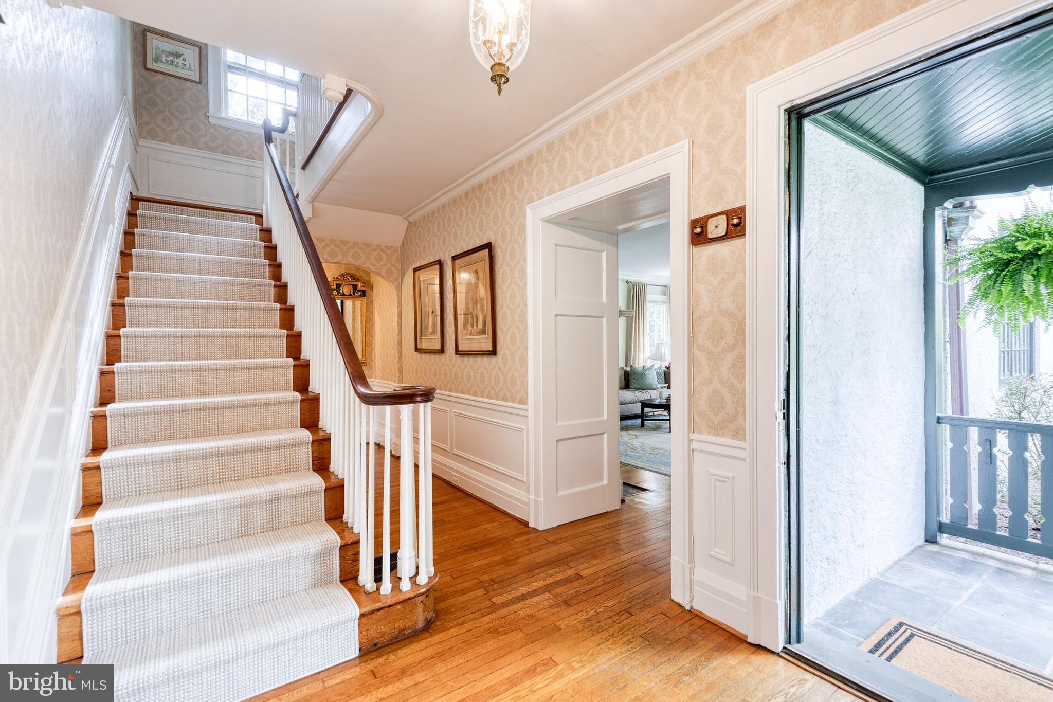 202 Taplow Road Baltimore, MD 21212 - Photo 7 of 56 a view of entryway and hall with wooden floor