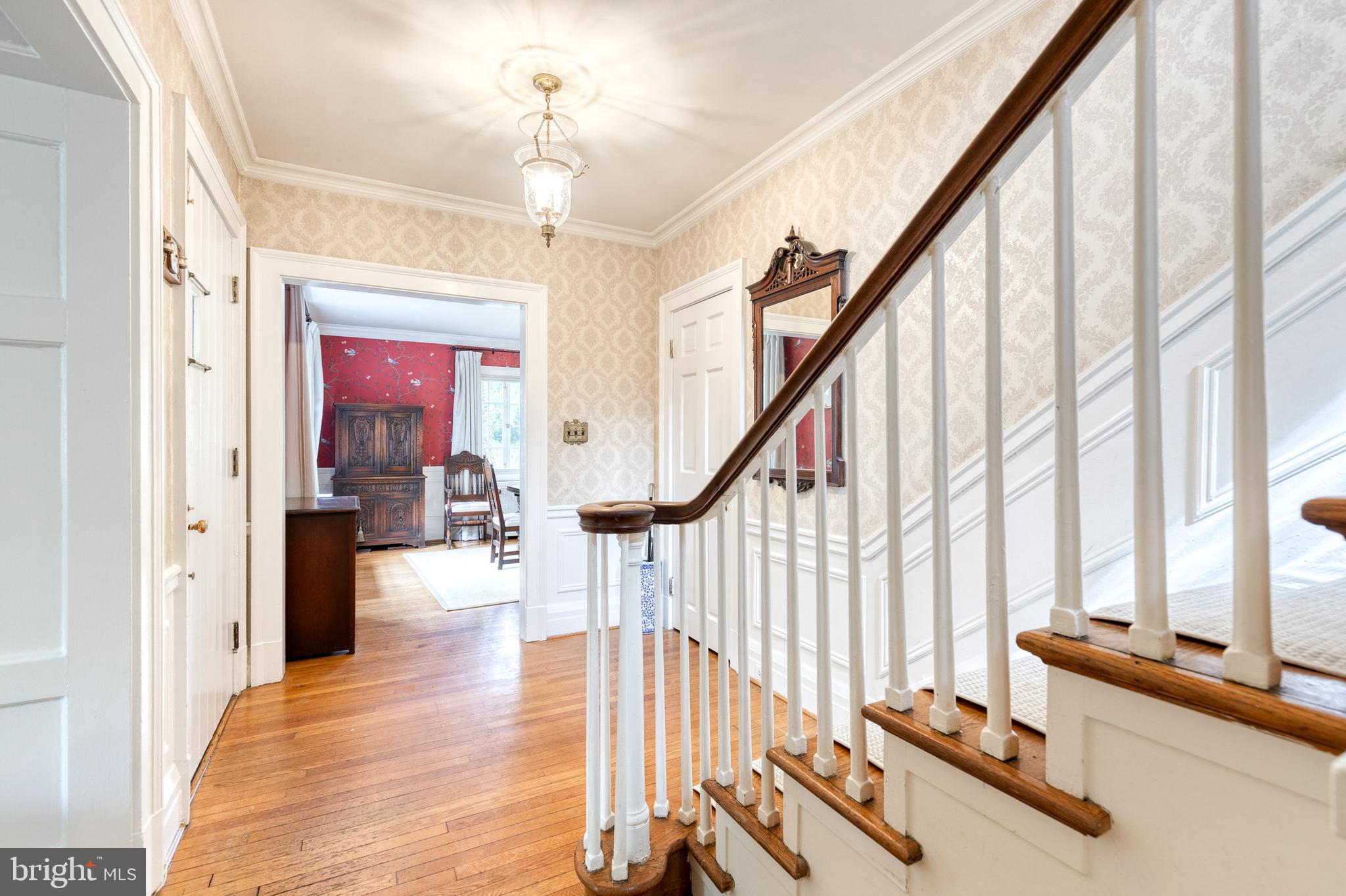 202 Taplow Road Baltimore, MD 21212 - Photo 8 of 56 a view of an entryway with wooden floor and windows