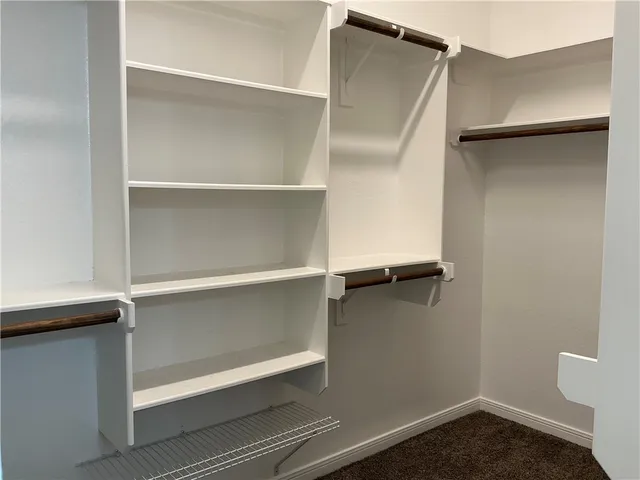 a view of an empty walk in closet