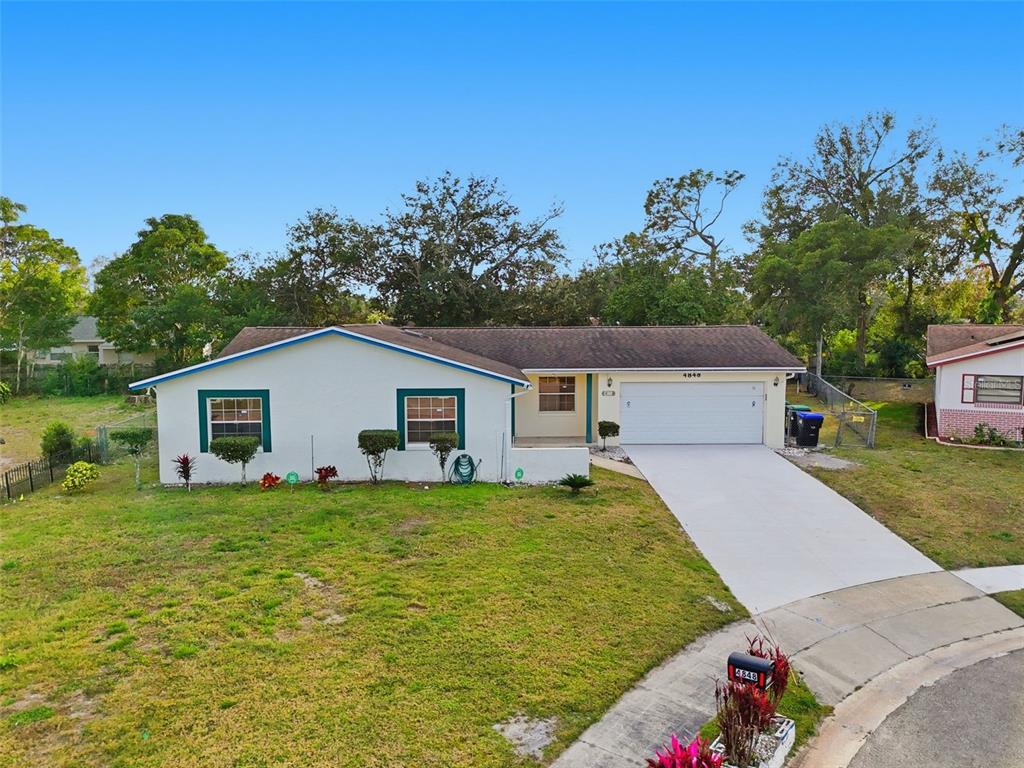 4848 Judy Ann Court Orlando, FL 32808 - Photo 2 of 39 a house view with a garden space