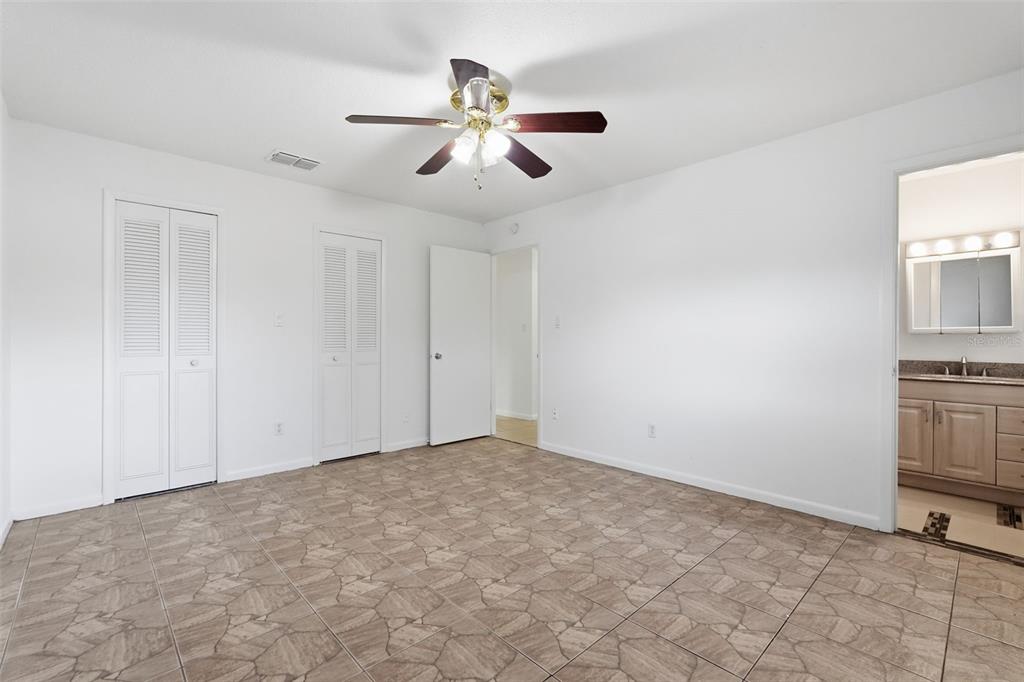 4848 Judy Ann Court Orlando, FL 32808 - Photo 21 of 39 a view of room with window and ceiling fan
