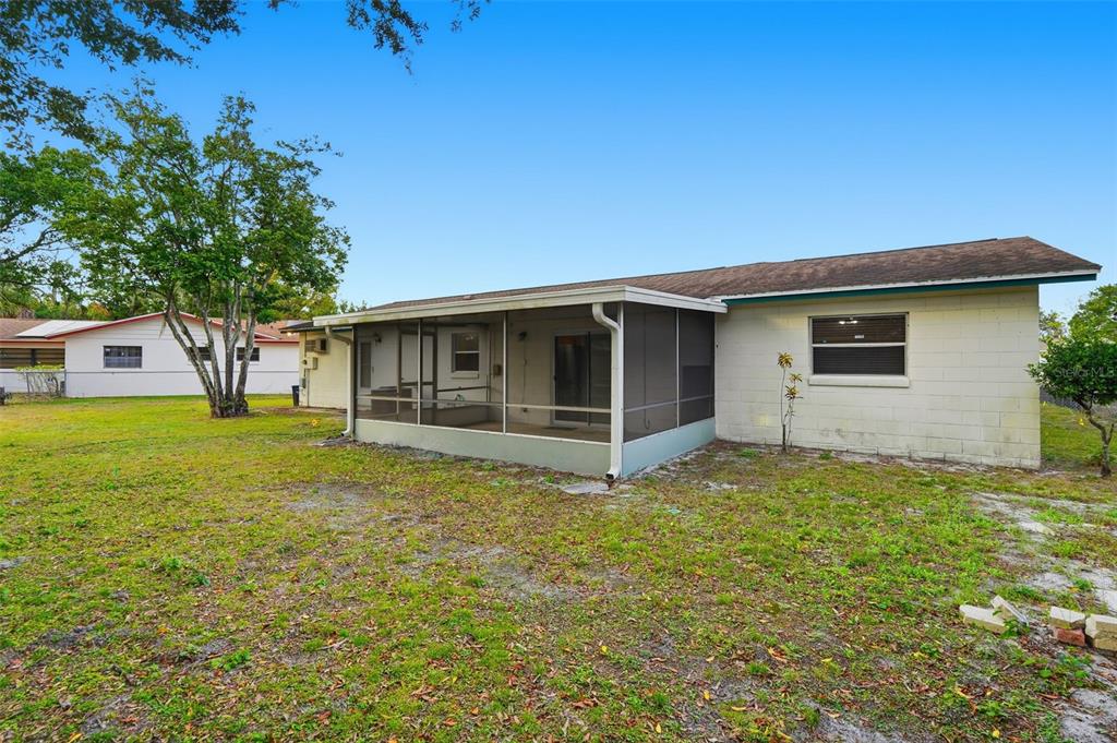 4848 Judy Ann Court Orlando, FL 32808 - Photo 32 of 39 a view of a house with a yard