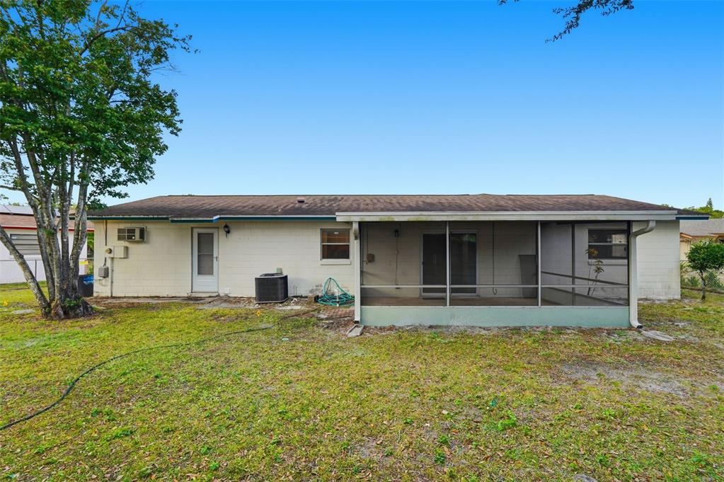 4848 Judy Ann Court Orlando, FL 32808 - Photo 33 of 39 a house view with a garden space