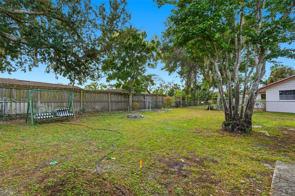 4848 Judy Ann Court Orlando, FL 32808 - Photo 35 of 39 a view of a yard with a trees