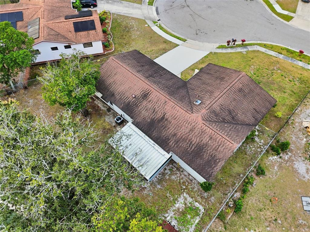 4848 Judy Ann Court Orlando, FL 32808 - Photo 38 of 39 an aerial view of a house with a yard wooden table and chairs