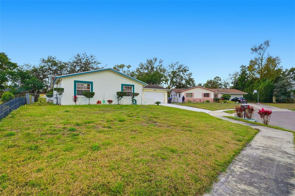 4848 Judy Ann Court Orlando, FL 32808 - Photo 5 of 39 a view of a house with backyard and garden