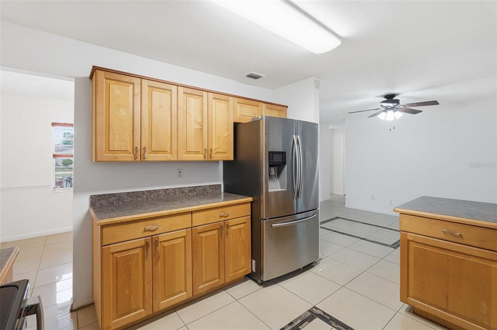 4848 Judy Ann Court Orlando, FL 32808 - Photo 8 of 39 a kitchen with appliances cabinets and a sink