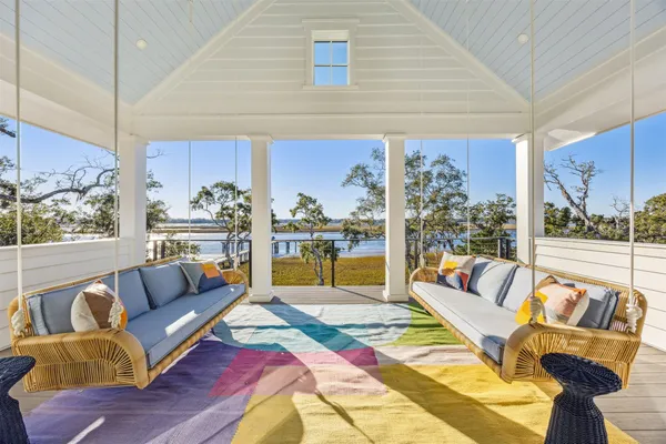 a living room with fireplace furniture and a flat screen tv