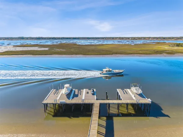 a kitchen with stainless steel appliances granite countertop a stove and a white cabinets
