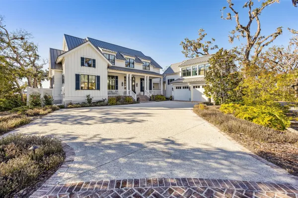 a kitchen with stainless steel appliances granite countertop a refrigerator and stove top oven