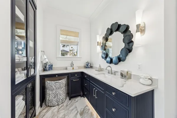 a bathroom with a shower sink and mirror