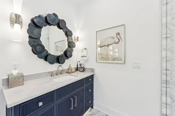 a bedroom with a bed and a wooden floor