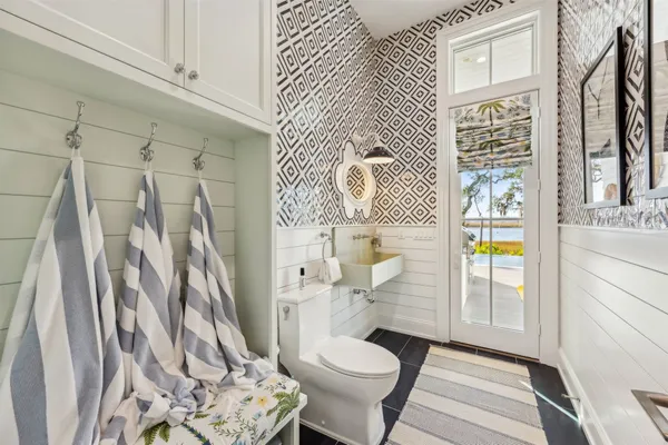 an aerial view of a house with swimming pool and sitting area