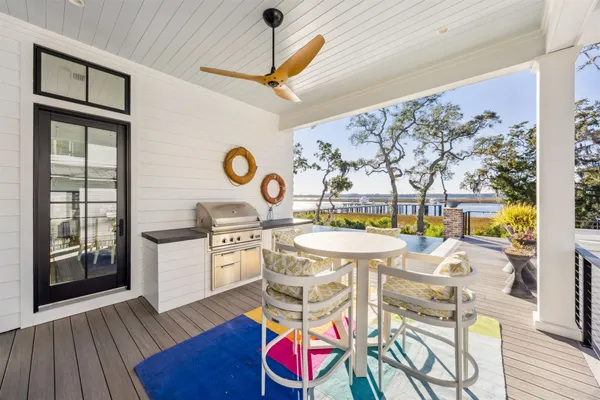 a view of a livingroom with furniture and a window