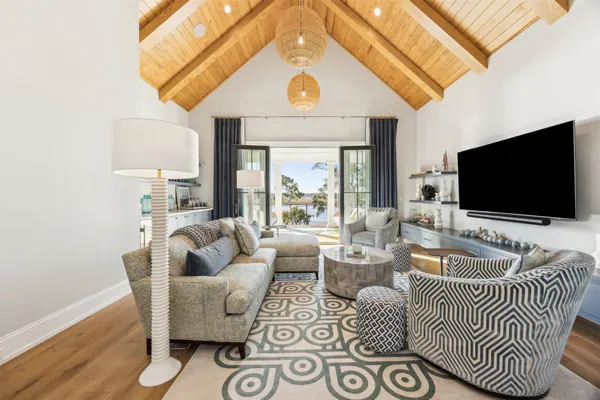 a view of a house with backyard water fountain and sitting area