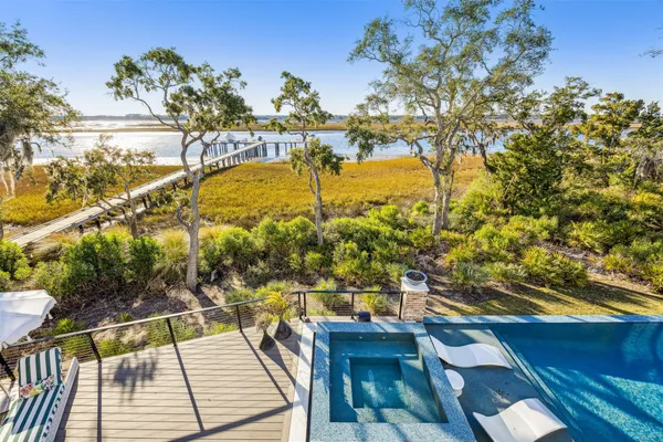 a front view of a house with a yard and a garage