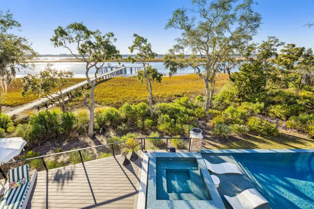 a front view of a house with a yard and a garage