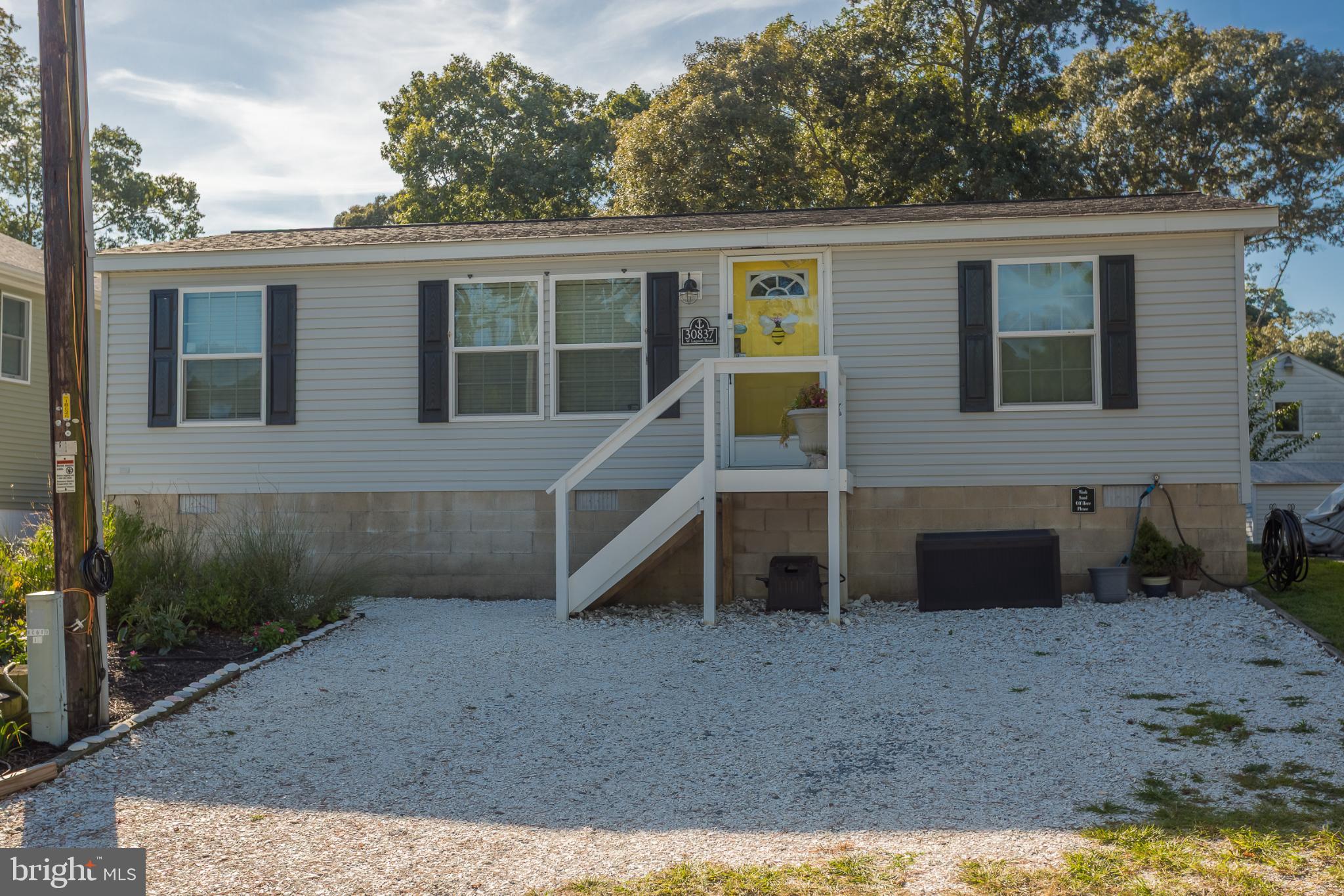 Charming home with inviting yellow door.