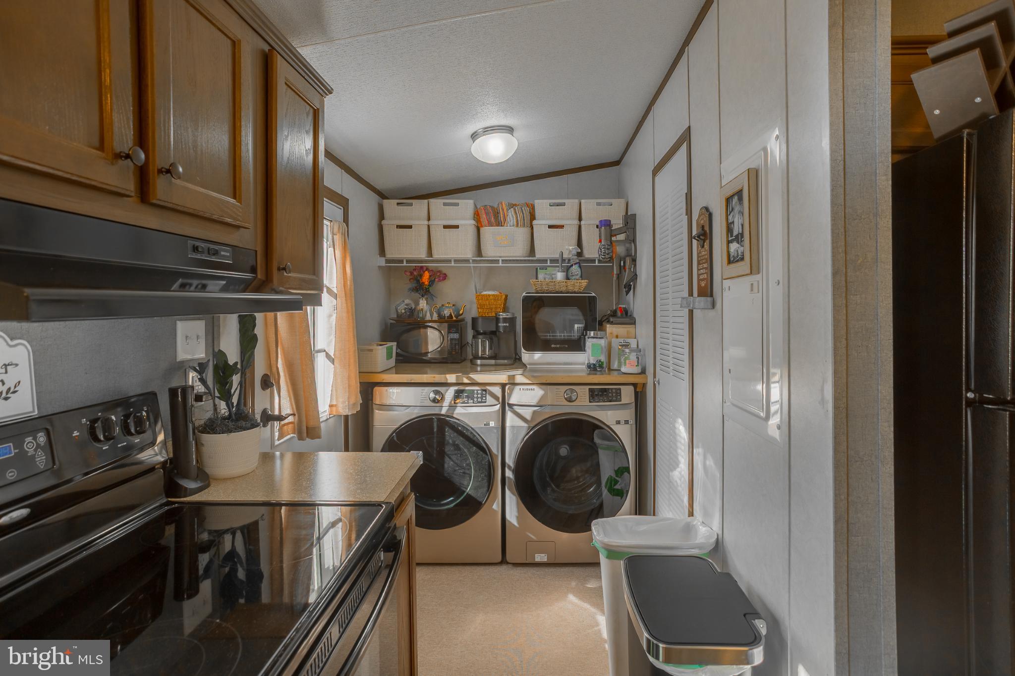 30837 West Lagoon Road Dagsboro, DE 19939 - Photo 12 of 36 Charming laundry nook with modern appliances.