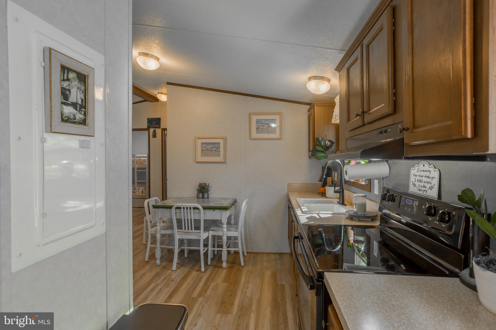 30837 West Lagoon Road Dagsboro, DE 19939 - Photo 13 of 36 Charming kitchen with warm wooden accents.