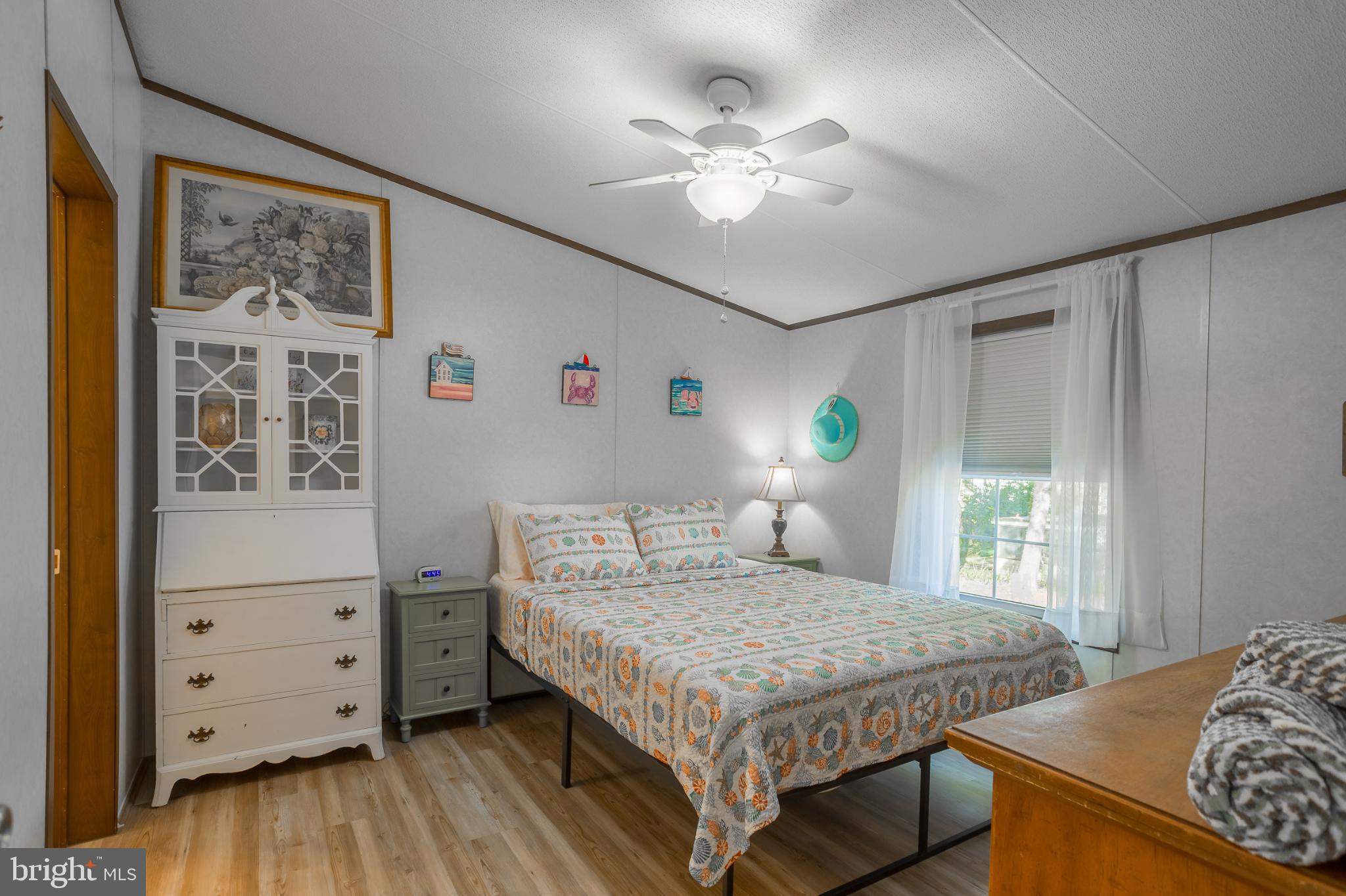 30837 West Lagoon Road Dagsboro, DE 19939 - Photo 14 of 36 Cozy bedroom with natural light and charm.