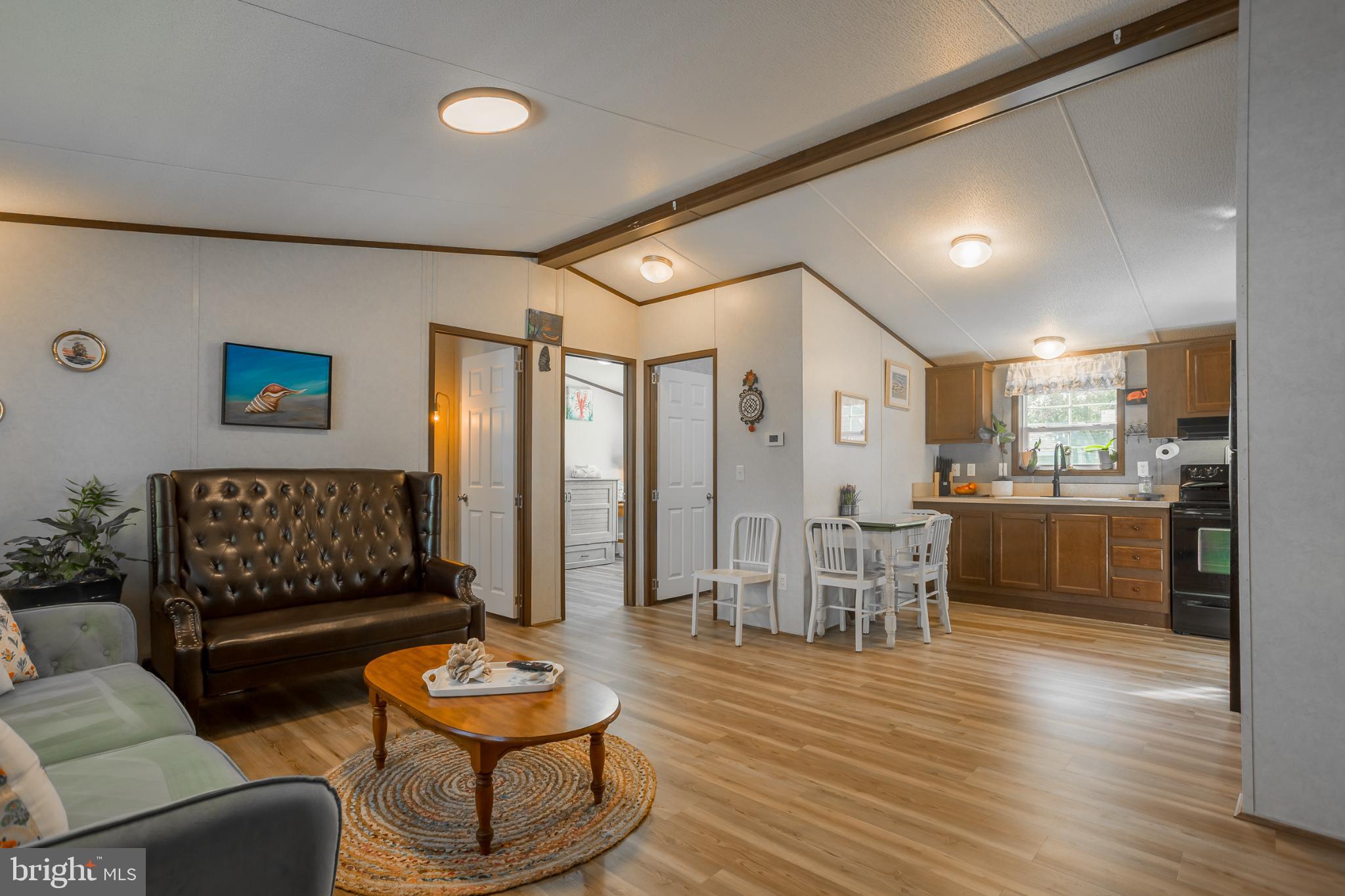 30837 West Lagoon Road Dagsboro, DE 19939 - Photo 7 of 36 Cozy open-plan living space with charm.