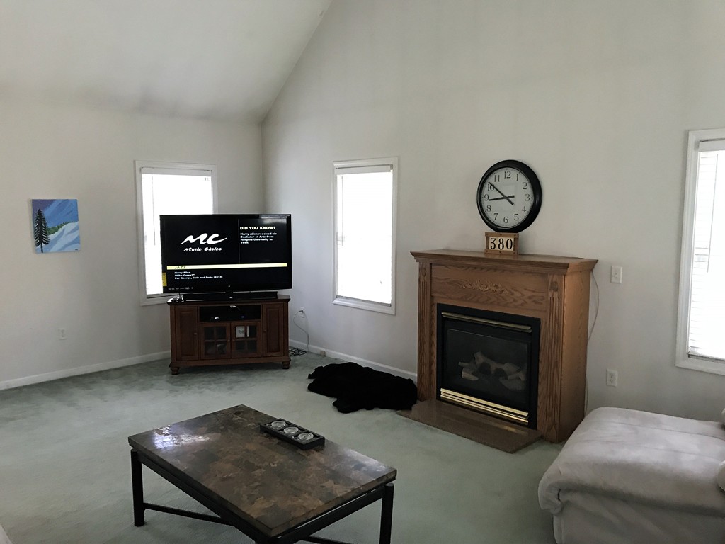 380 Richardson Road Dracut, MA 01826 - Photo 11 of 21 a living room with furniture and a fireplace